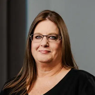 A headshot of Debra Shipp, a staff member at Larger Than Life Chiropractic.