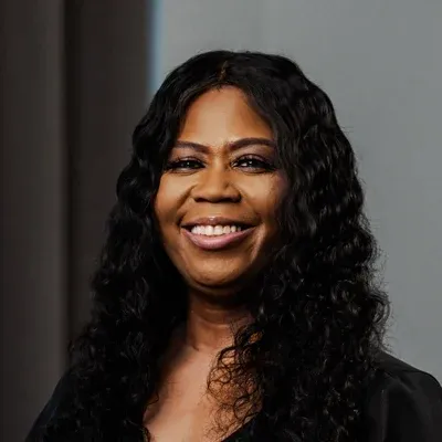 A headshot of Ebony Butts, a staff member at Larger Than Life Chiropractic.